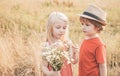 Kids play in autumn park. Children outdoor fun in autumn. Toddler kids or preschooler child in fall. Royalty Free Stock Photo