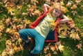 Kids play in autumn park. Children portrait with yellow leaves. Child boy with oak and maple leaf outdoor. Fall foliage Royalty Free Stock Photo