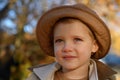 Kids play in autumn park. Children portrait with yellow leaves. Child boy with oak and maple leaf outdoor. Fall foliage Royalty Free Stock Photo