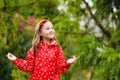 Kids play in autumn rain. Child on rainy day