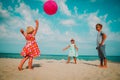 Kids play with ball on beach vacation, boy and girls have fun at sea Royalty Free Stock Photo