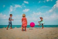 Kids play with ball on beach vacation, boy and girls have fun at sea Royalty Free Stock Photo