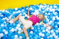 Kids play in ball pit. Child playing in balls pool Royalty Free Stock Photo