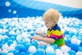 Kids play in ball pit. Child playing in balls pool Royalty Free Stock Photo