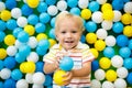 Kids play in ball pit. Child playing in balls pool Royalty Free Stock Photo