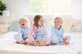 Kids play in bed. Children at home Royalty Free Stock Photo