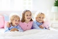Kids play in bed. Children at home Royalty Free Stock Photo