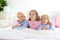 Kids play in bed. Children at home Royalty Free Stock Photo