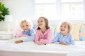 Kids play in bed. Children at home Royalty Free Stock Photo