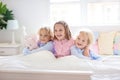 Kids play in bed. Children at home Royalty Free Stock Photo