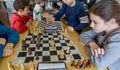 Kids play chess during chess competition in chess club. Education, chess and mind games. Competition and tournament. Royalty Free Stock Photo