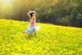 Kids play. Child in dandelion field. Summer flower Royalty Free Stock Photo