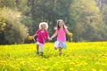 Kids play. Child in dandelion field. Summer flower Royalty Free Stock Photo