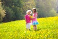 Kids play. Child in dandelion field. Summer flower Royalty Free Stock Photo