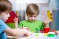 Kids with play clay at home Royalty Free Stock Photo