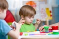 Kids with play clay at home Royalty Free Stock Photo