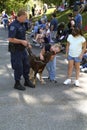 Children play with a deputy sheriff`s k-9 dog in Greenbelt, Maryland