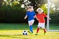 Kids play football. Child at soccer field Royalty Free Stock Photo