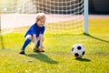 Kids play football. Child at soccer field