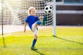 Kids play football. Child at soccer field