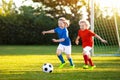 Kids play football. Child at soccer field. Royalty Free Stock Photo