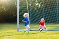 Kids play football. Child at soccer field Royalty Free Stock Photo