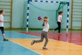 Kids play handball indoor. Sports and physical activity. Training and sports for children