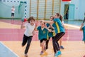 Kids play handball indoor. Sports and physical activity. Training and sports for children