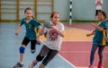 Kids play handball indoor. Sports and physical activity. Training and sports for children