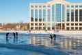 Kids play hockey on a frozen lake Royalty Free Stock Photo