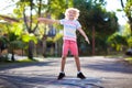 Kids play hopscotch in summer park. Outdoor game Royalty Free Stock Photo