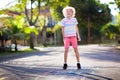 Kids play hopscotch in summer park. Outdoor game Royalty Free Stock Photo