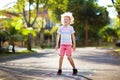 Kids play hopscotch in summer park. Outdoor game Royalty Free Stock Photo