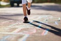 Kids play hopscotch in summer park. Outdoor game Royalty Free Stock Photo