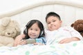 Kids play mobile phone on bedroom. Royalty Free Stock Photo