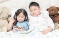 Kids play mobile phone on bedroom. Royalty Free Stock Photo