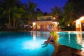 Kids in swimming pool at night Royalty Free Stock Photo