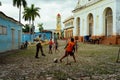 Kids play outdoors in the streets of Trinidad, Cuba