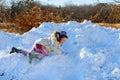 Kids play outside winter season Happy kid playing in the snow near a forest Royalty Free Stock Photo
