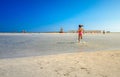 Kids play and run on the famous sandy beach of Elafonissi, Crete, Greece.