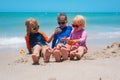 Kids play with sand on beach, boy and girls enjoy sea vacation Royalty Free Stock Photo