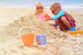 Kids play with sand on summer beach Royalty Free Stock Photo