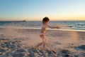 Kids play with sand on summer beach. Happy child boy playing in the sea. Kid having fun outdoors. Summer vacation Royalty Free Stock Photo