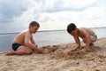 Kids play on sandy beach of Lake Selige Royalty Free Stock Photo