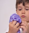 Kids play with slime. Boy stretch handgum or toy slime.