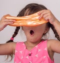 Kids play with slime. Girl stretch handgum or toy slime.