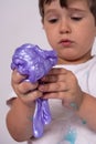 Kids play with slime. Boy stretch handgum or toy slime.