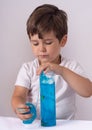 Kids play with slime. Boy stretch handgum or toy slime.