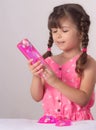 Children inflates a big bubble from a slime. Girl and boy play with slime.