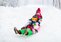 Kids play in snow. Winter sled ride for children Royalty Free Stock Photo